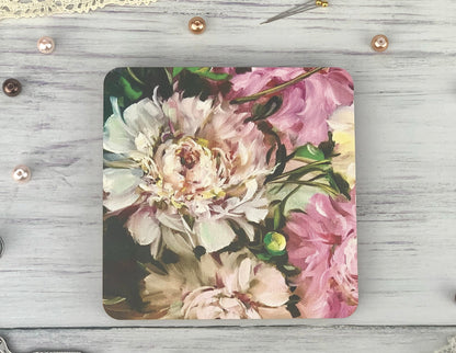 a square coaster with a picture of flowers on it