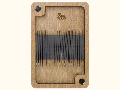 a close up of a piece of wood with needles