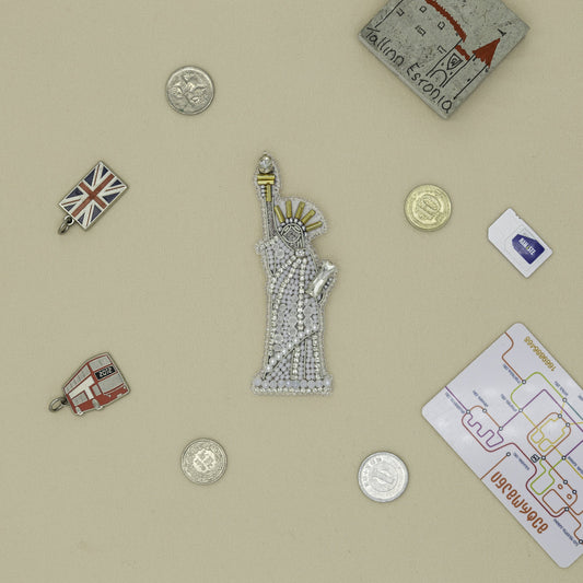 a collection of pins and magnets on a table