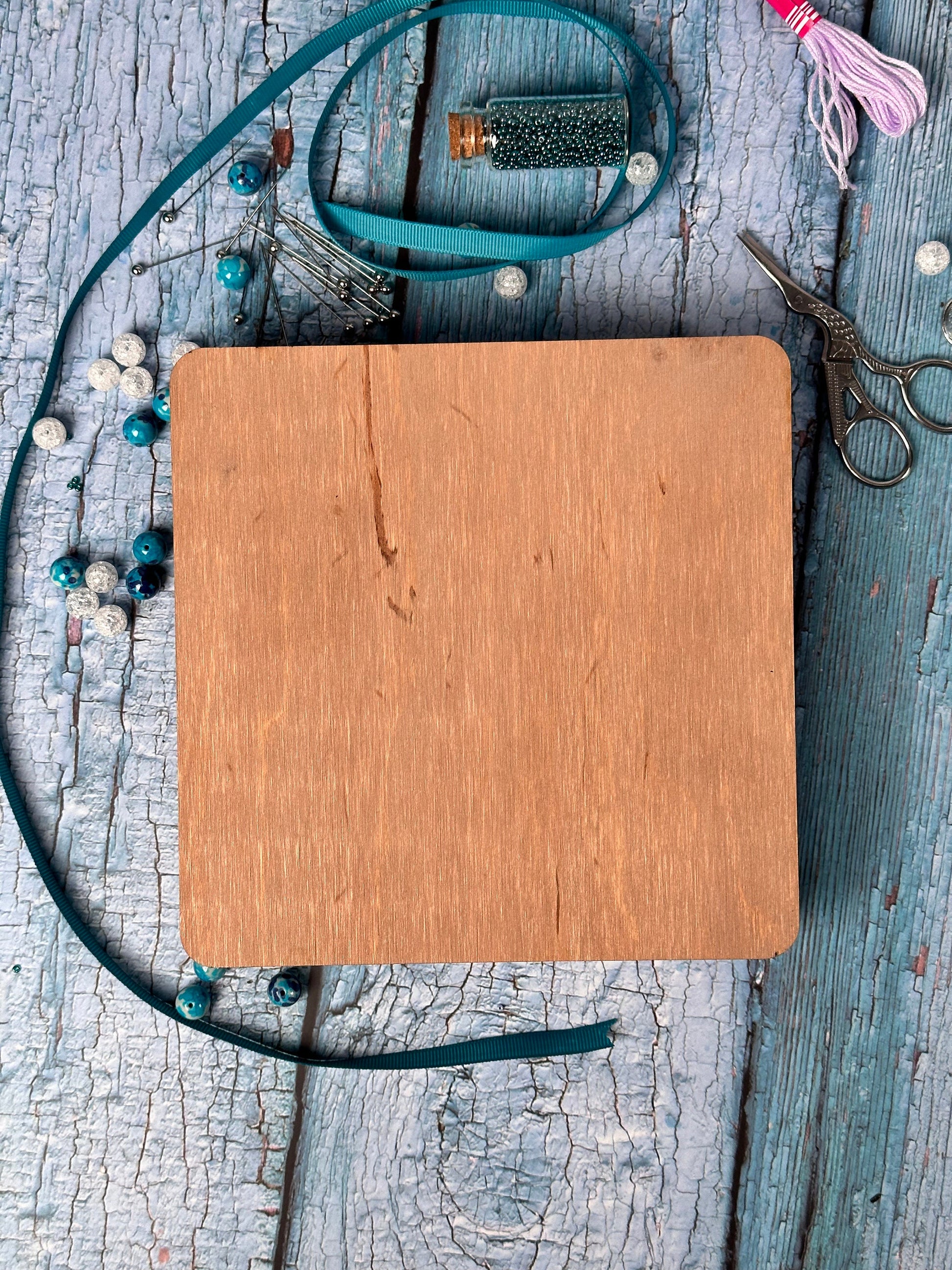 a wooden notebook sitting on top of a wooden table