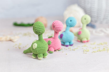 a group of crocheted toys sitting on top of a table
