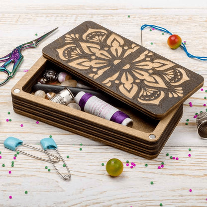 a wooden box filled with lots of craft supplies