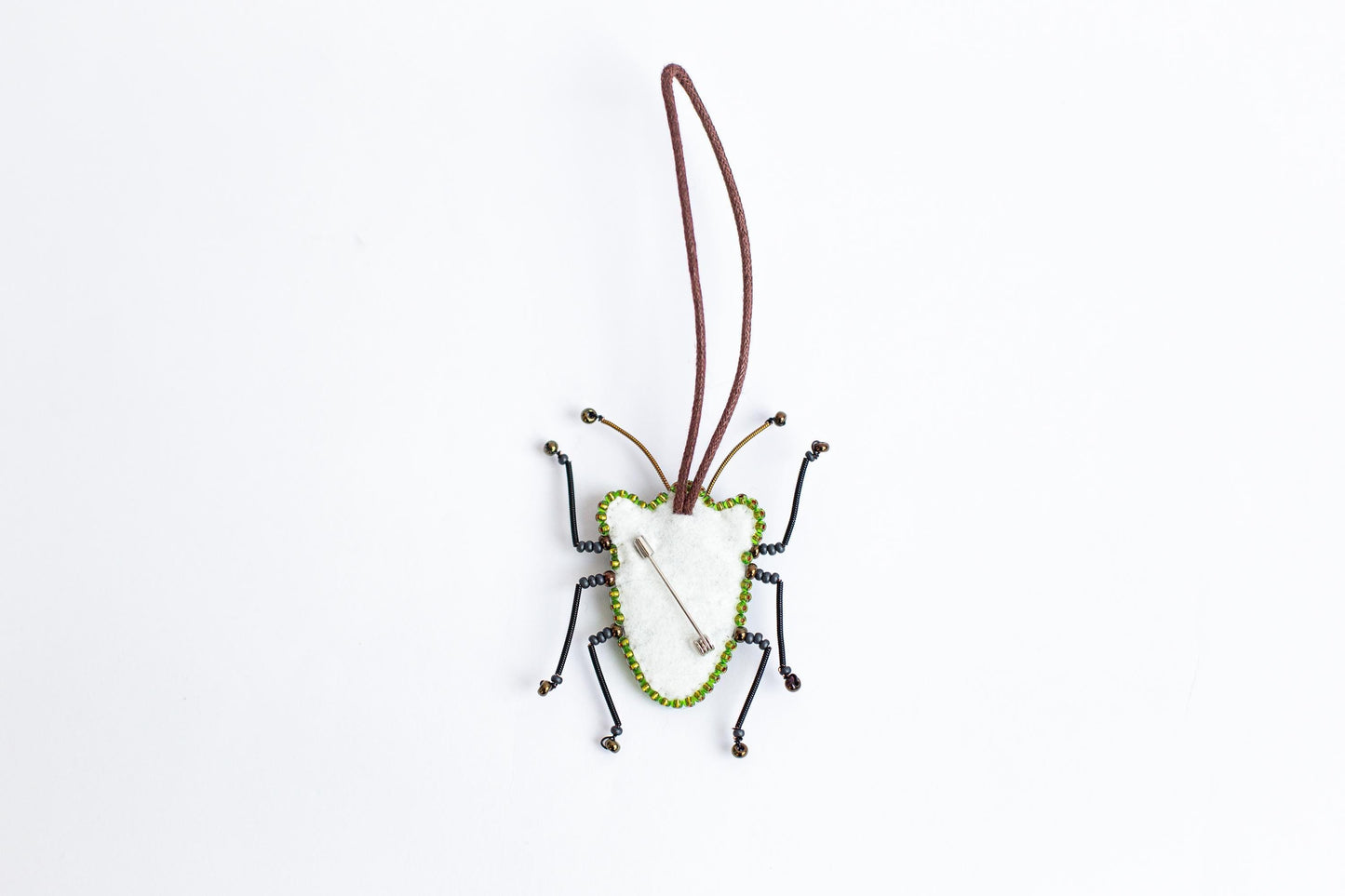 a bug ornament hanging from a cord