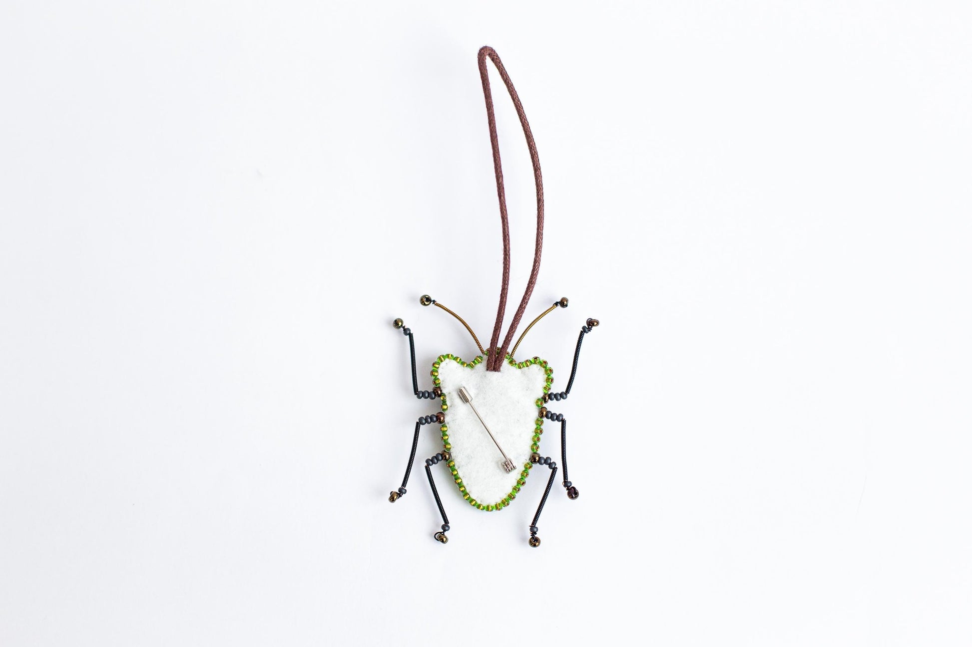 a bug ornament hanging from a cord