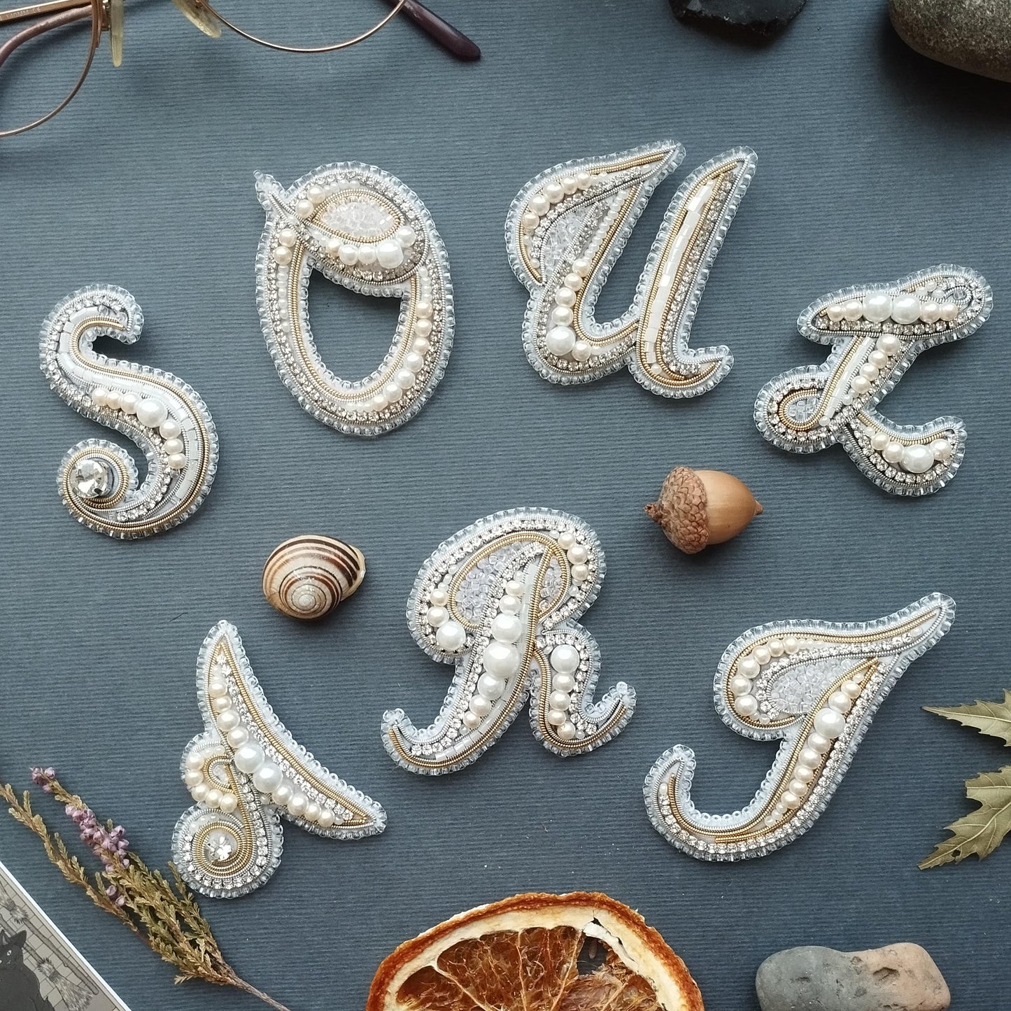 a collection of decorative elements arranged to spell out the word "SOUL" in a creative and artistic manner.