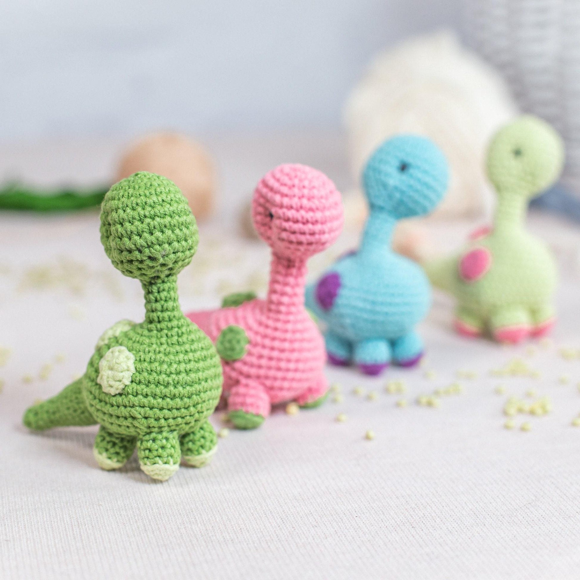 a group of crocheted toys sitting on top of a table
