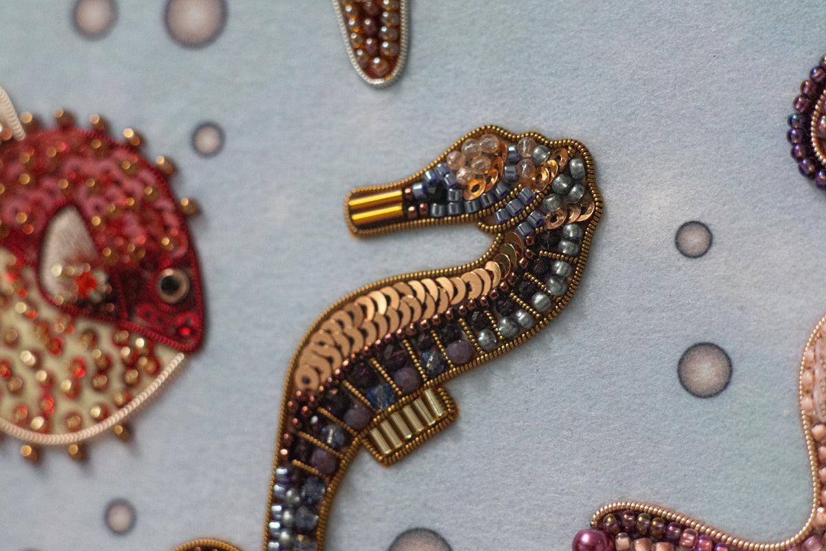 a close-up view of a decorative piece with a seahorse design, showcasing intricate details and craftsmanship.