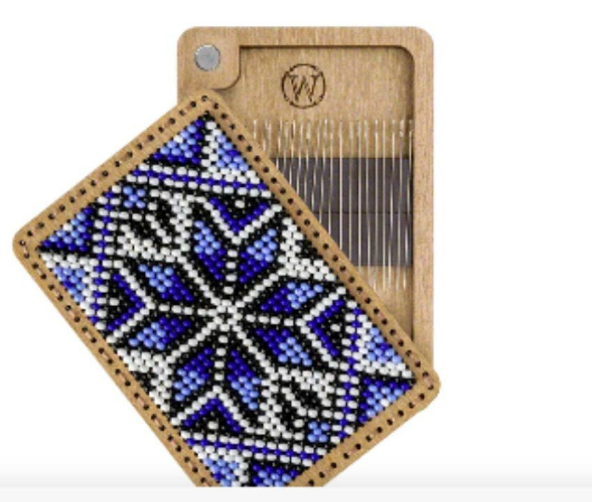 a piece of wood with a blue and white design on it