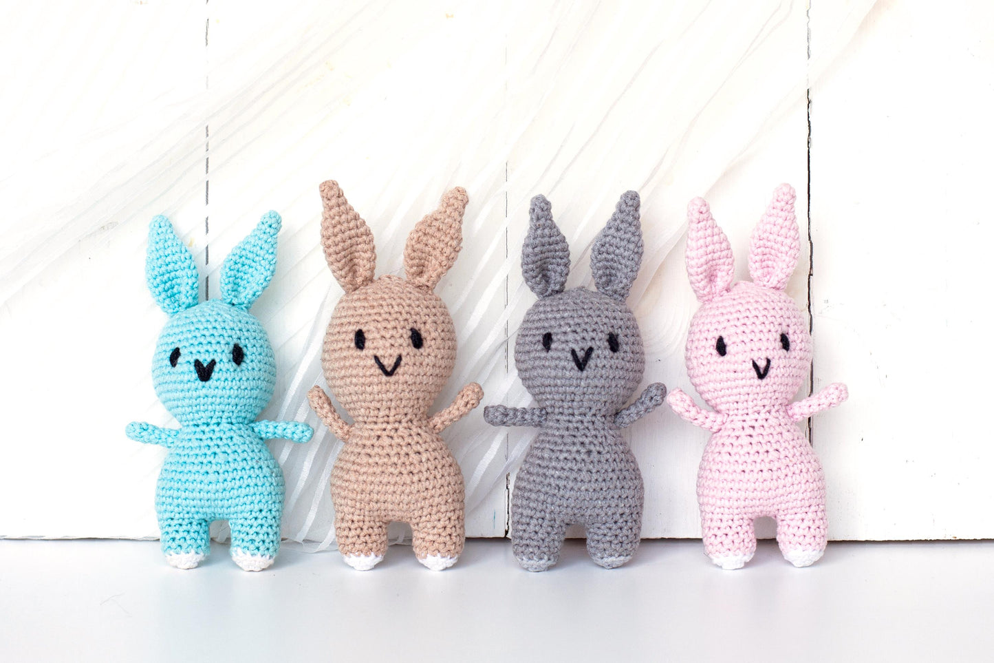 a group of crocheted bunnies sitting next to each other