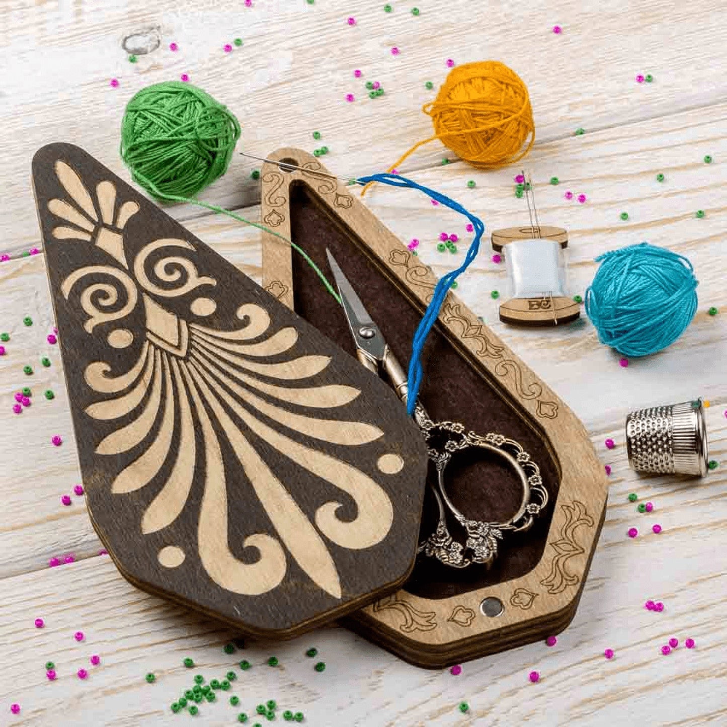 a pair of scissors in a wooden case