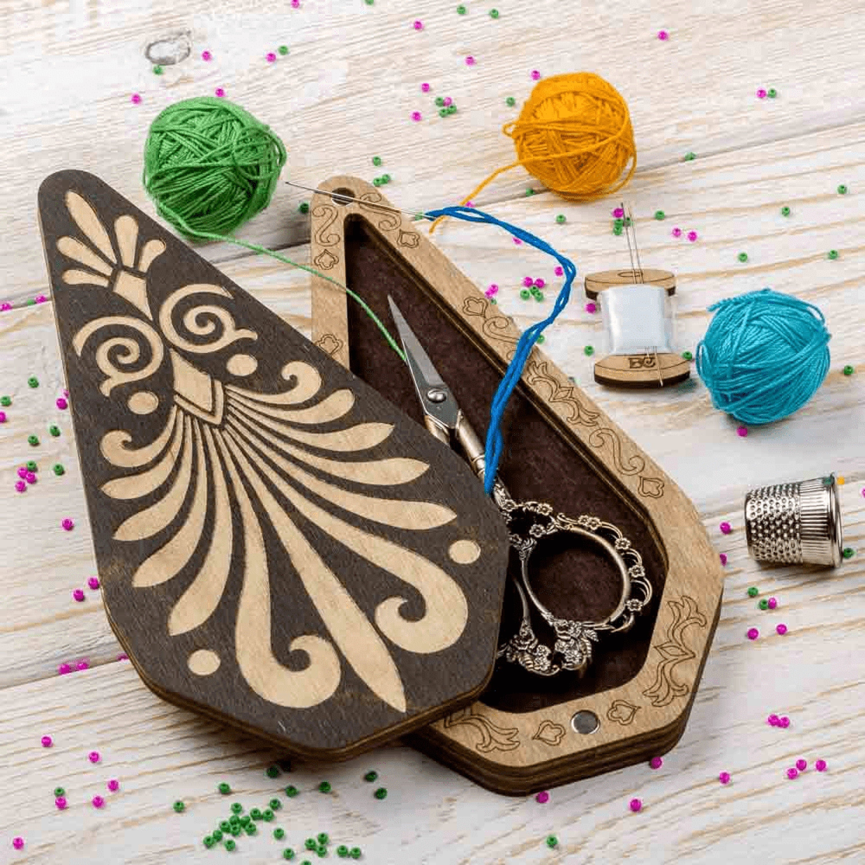 a pair of scissors in a wooden case