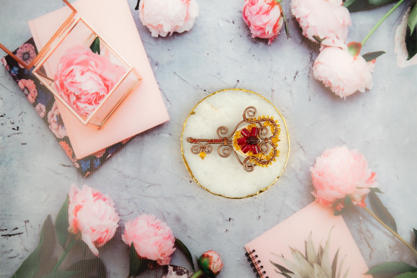 a cake with a key on top of it surrounded by flowers
