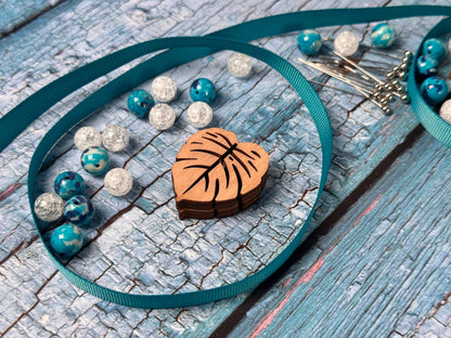 a necklace with a wooden heart on it