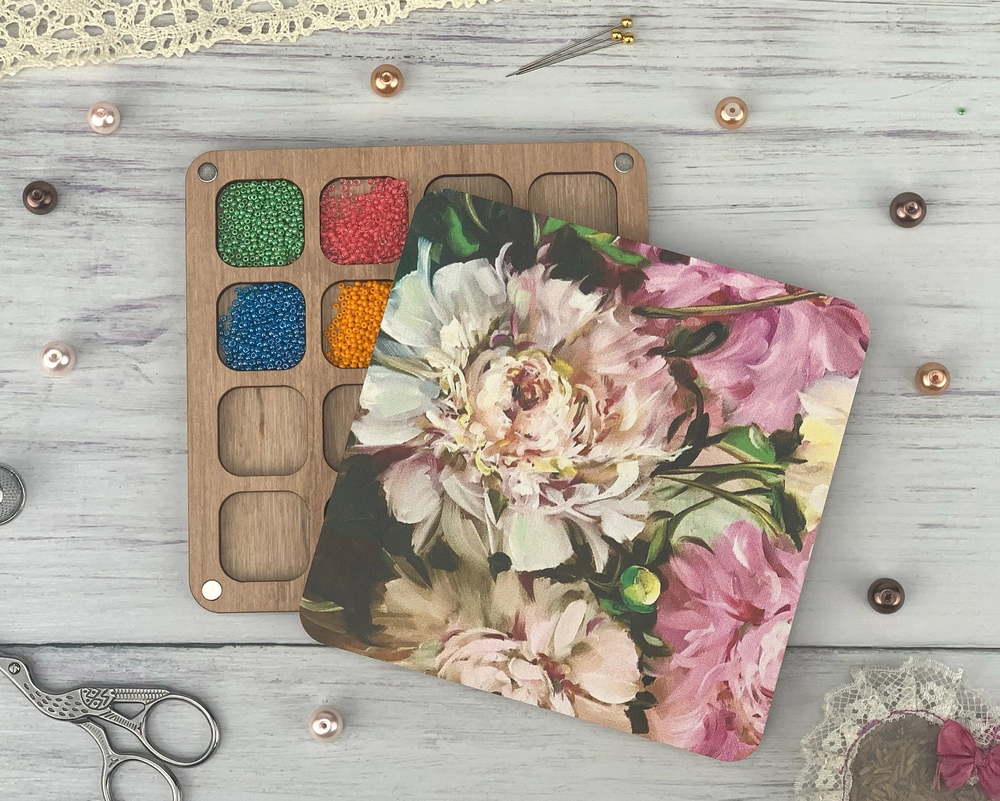 a table topped with crafting supplies next to a pair of scissors