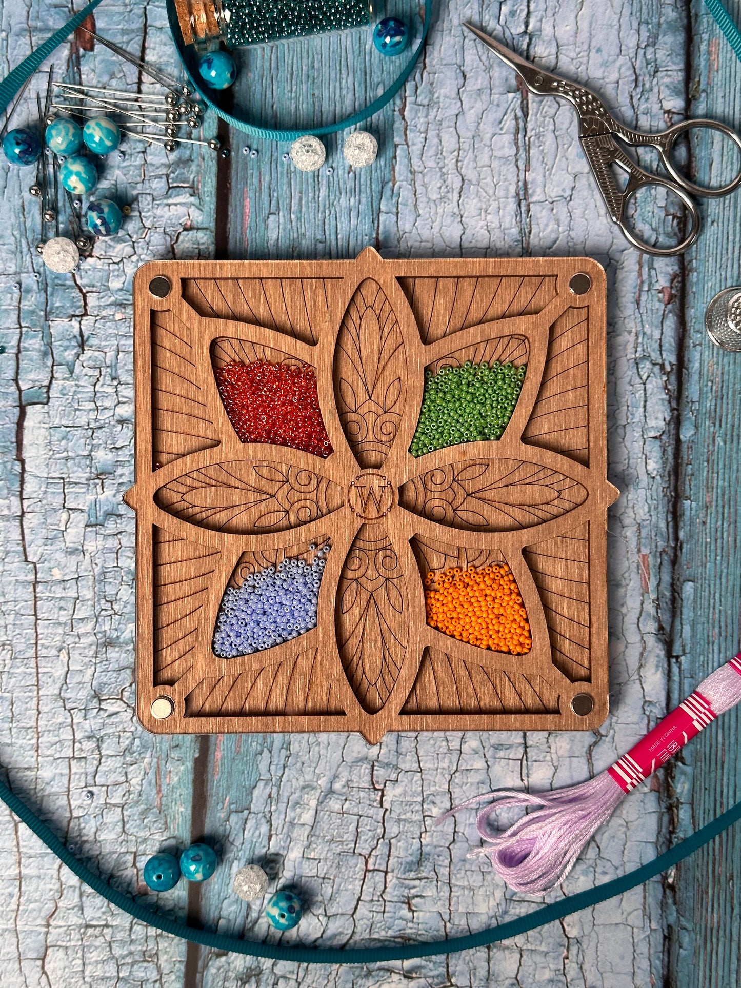 a wooden cutting board with a flower design on it