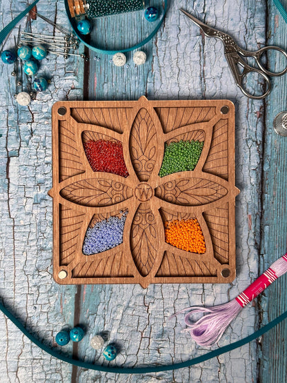 a wooden cutting board with a flower design on it