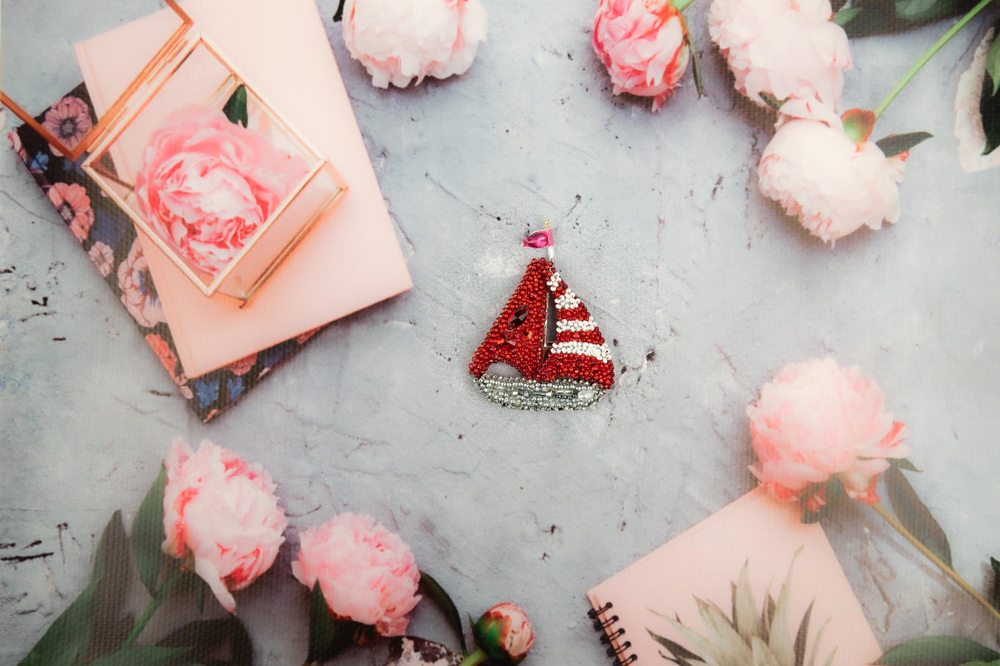 a red and white pin sitting on top of a table