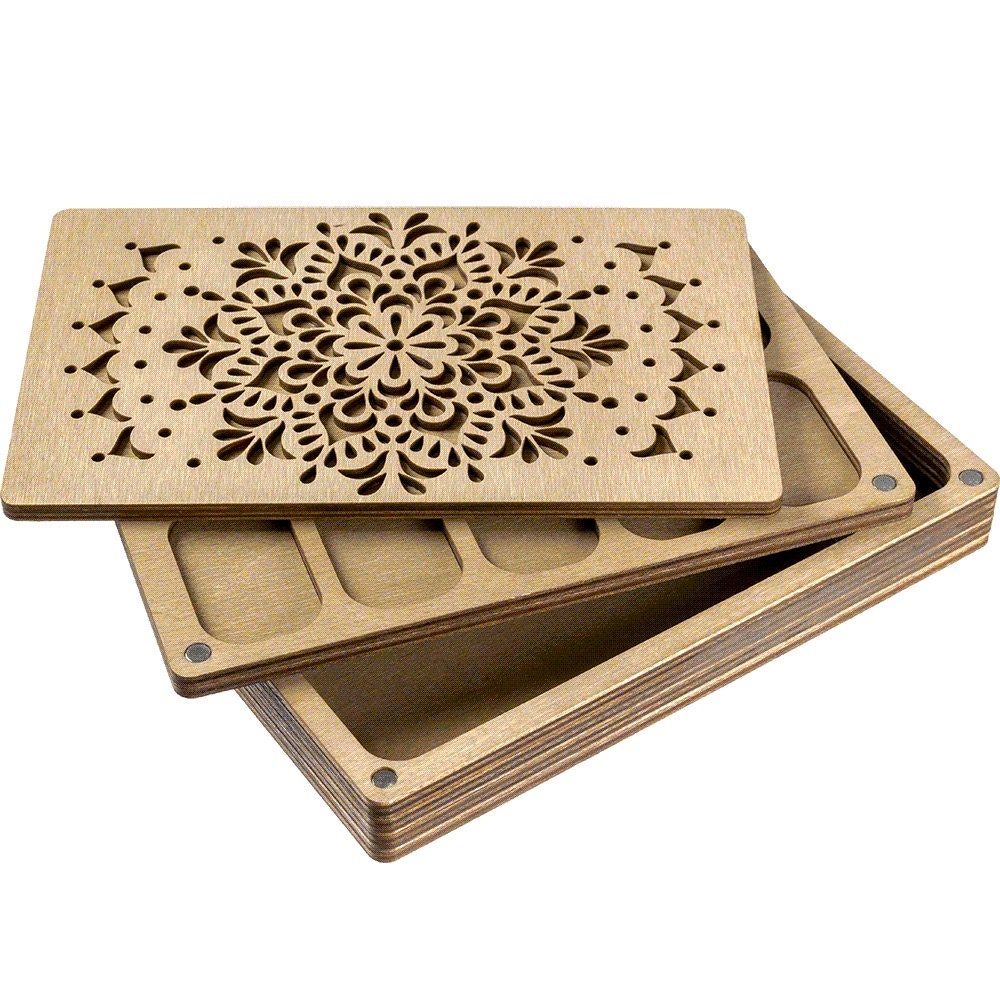 three wooden coasters with laser cut designs on them