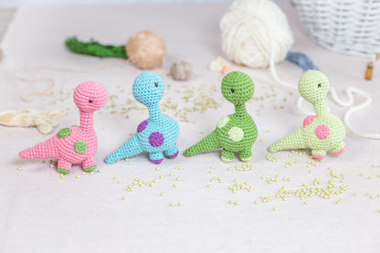a group of crocheted toys sitting on top of a table