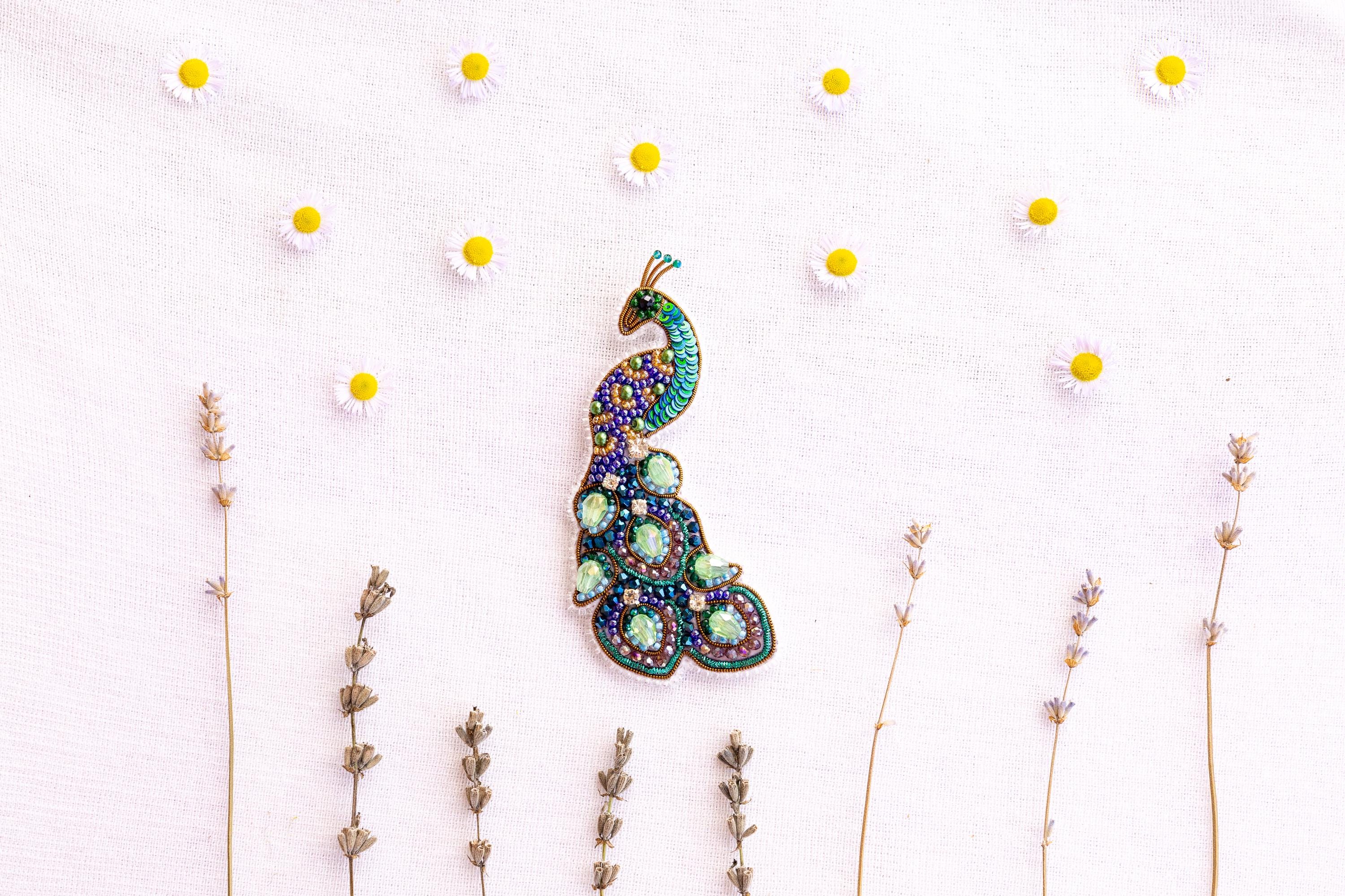 a picture of a brooch sitting on top of a table