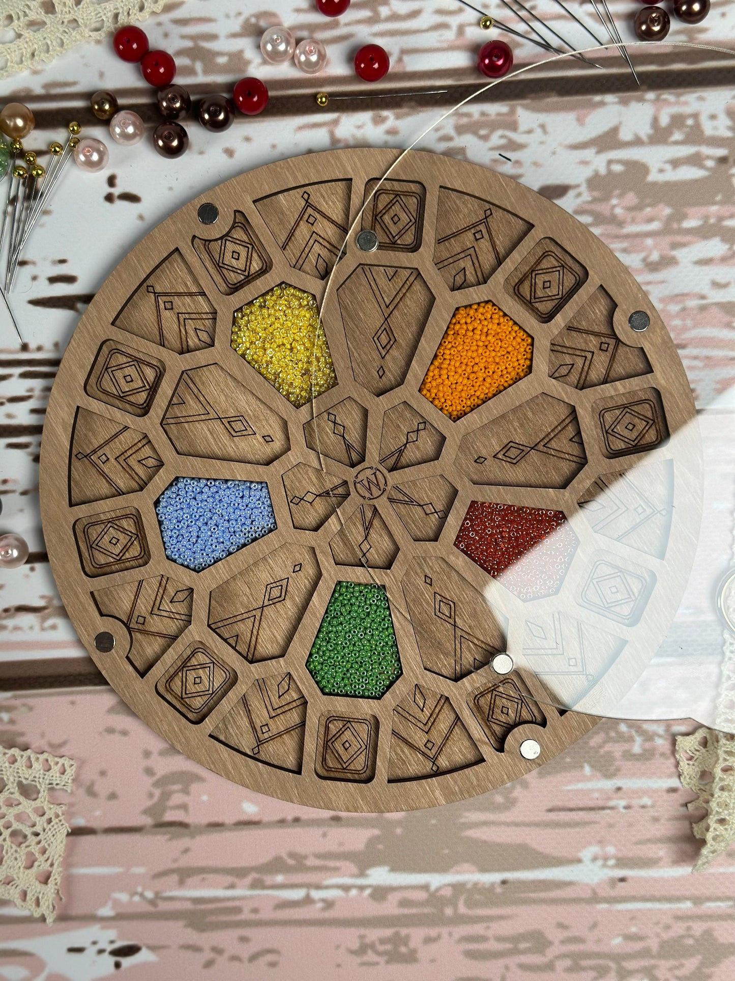 a wooden board with a bunch of beads on it