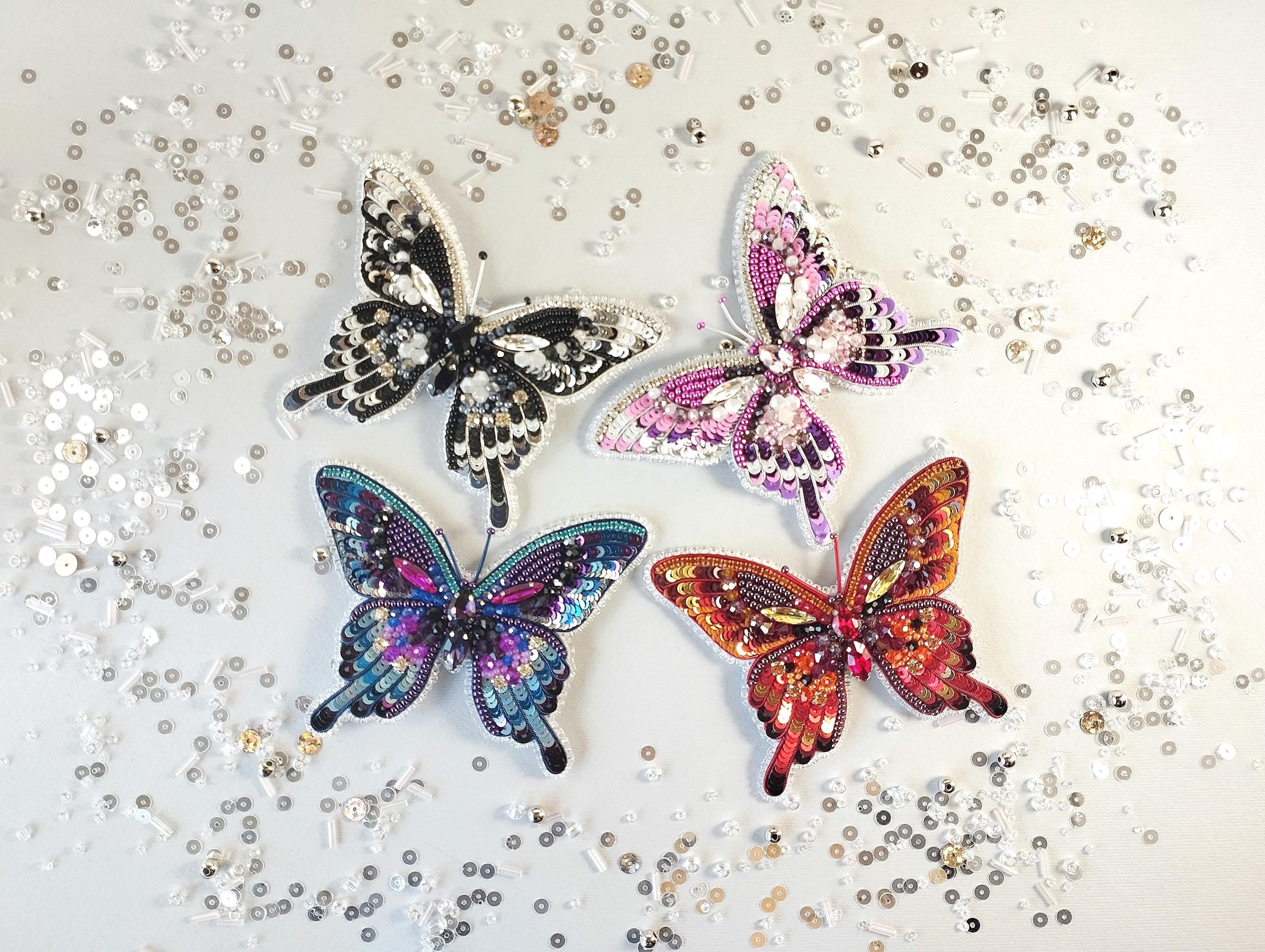 a group of three butterflies sitting on top of a table