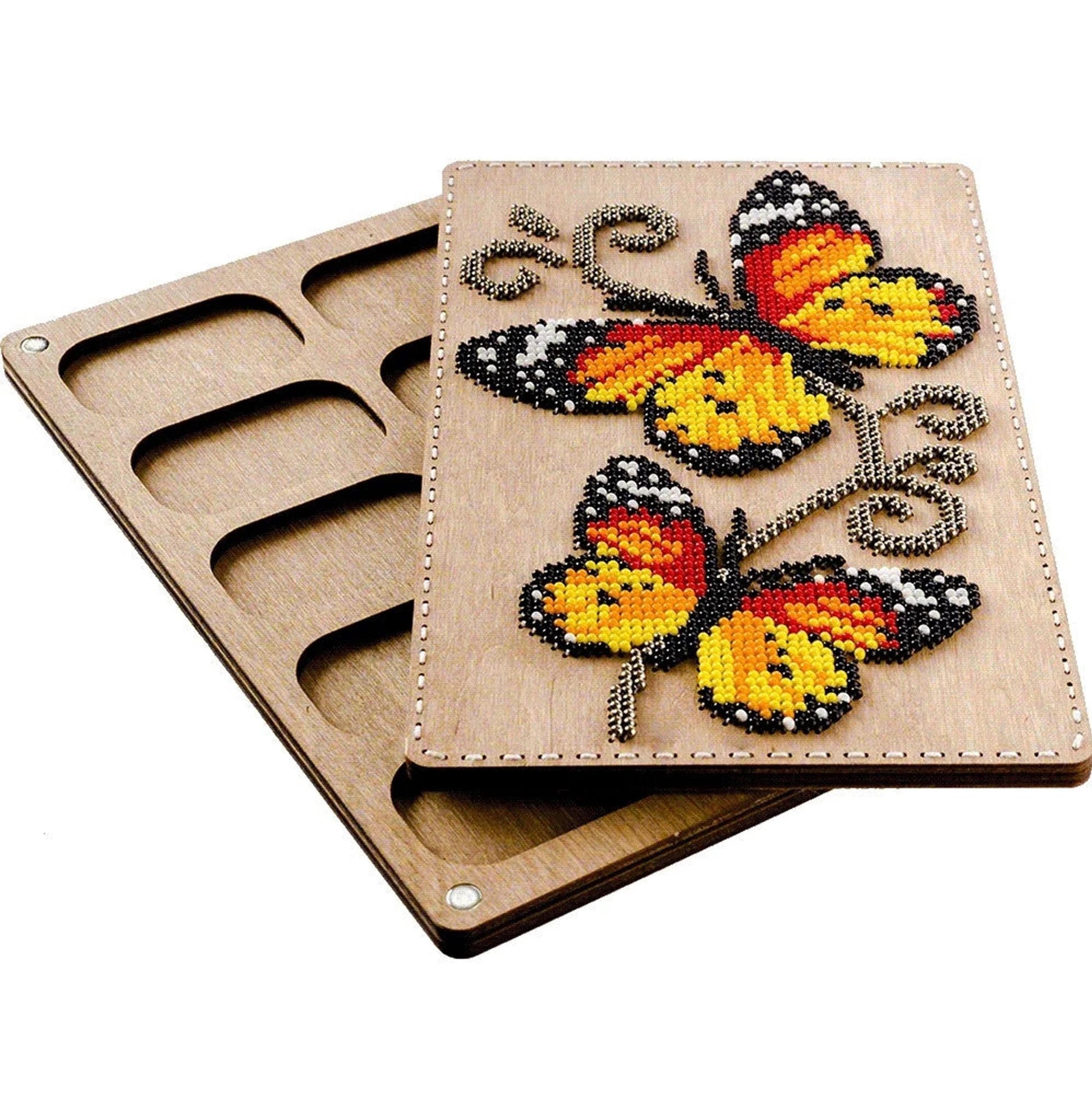 a wooden board with a design of colorful butterflies on it.