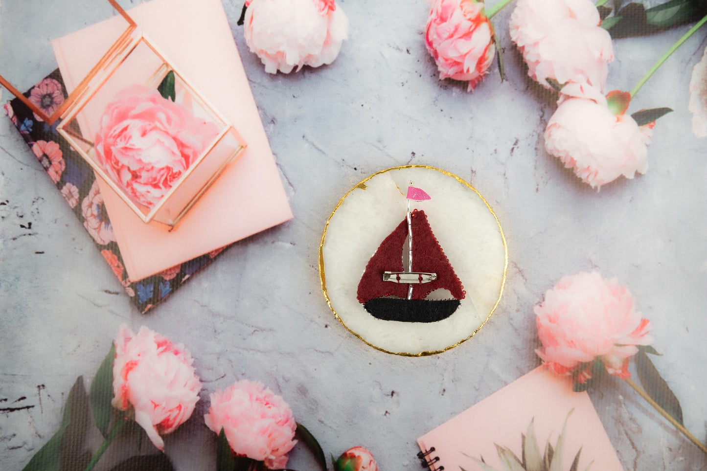 a small sailboat sitting on top of a table