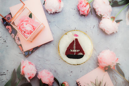 a small sailboat sitting on top of a table