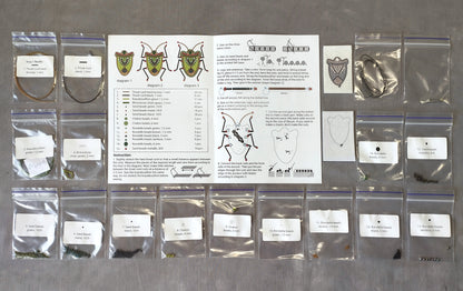 The image is a collection of various items, including bags, boxes, and instructions, arranged on a table.