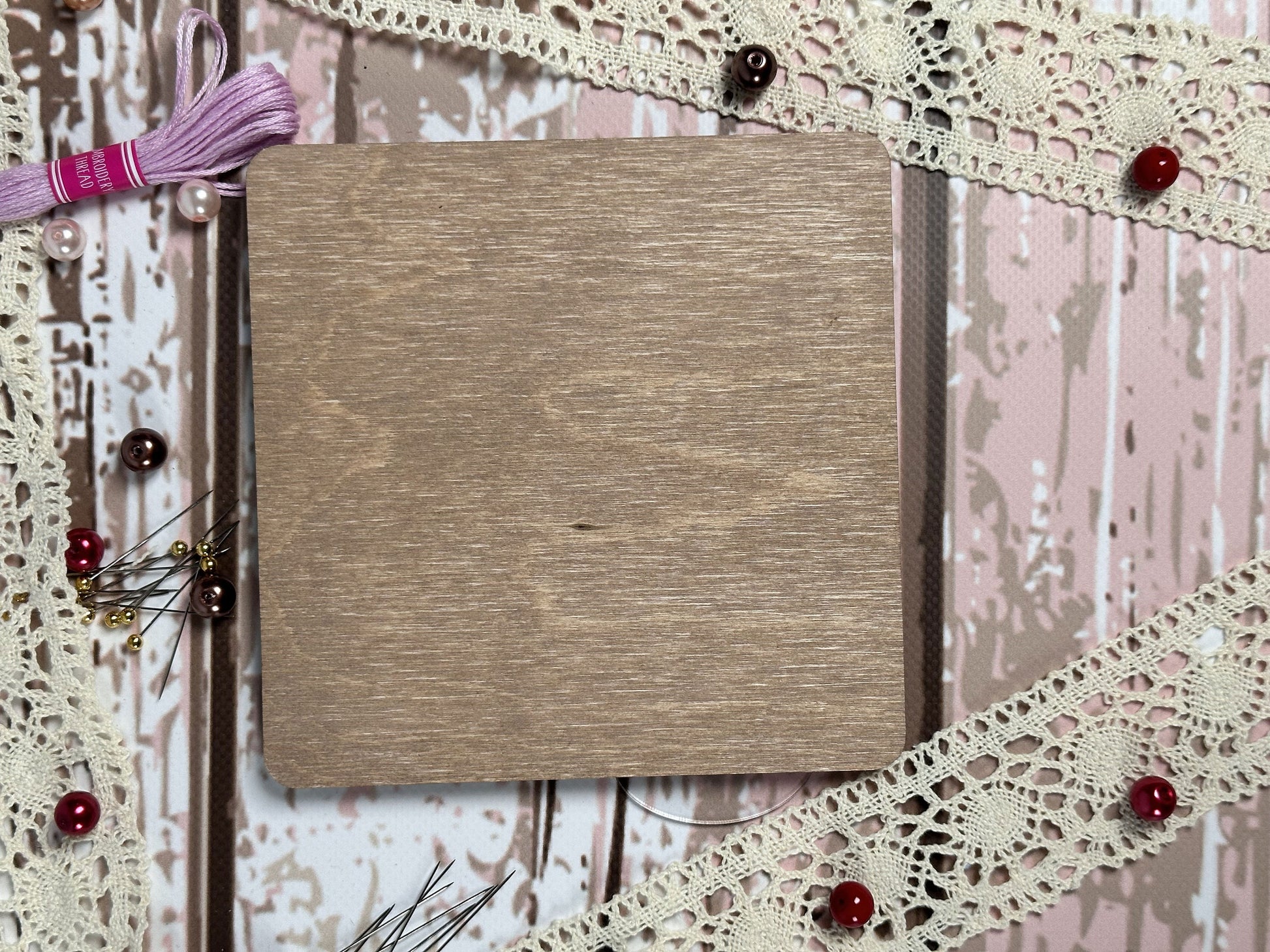 a book on a table with a string of thread