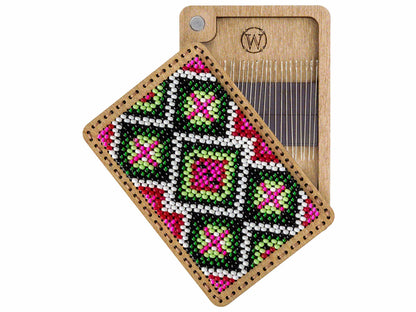 a wooden comb with a colorful beaded design on it