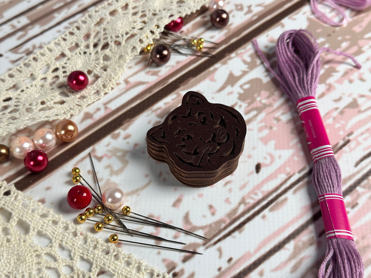 a piece of chocolate next to some knitting needles
