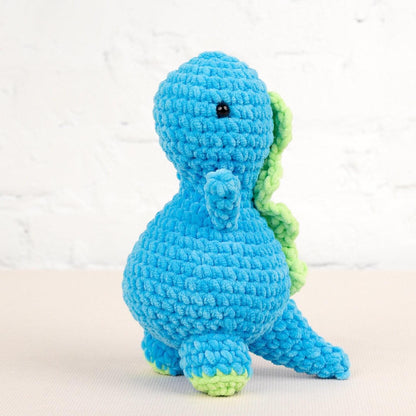 a crocheted blue and green stuffed animal