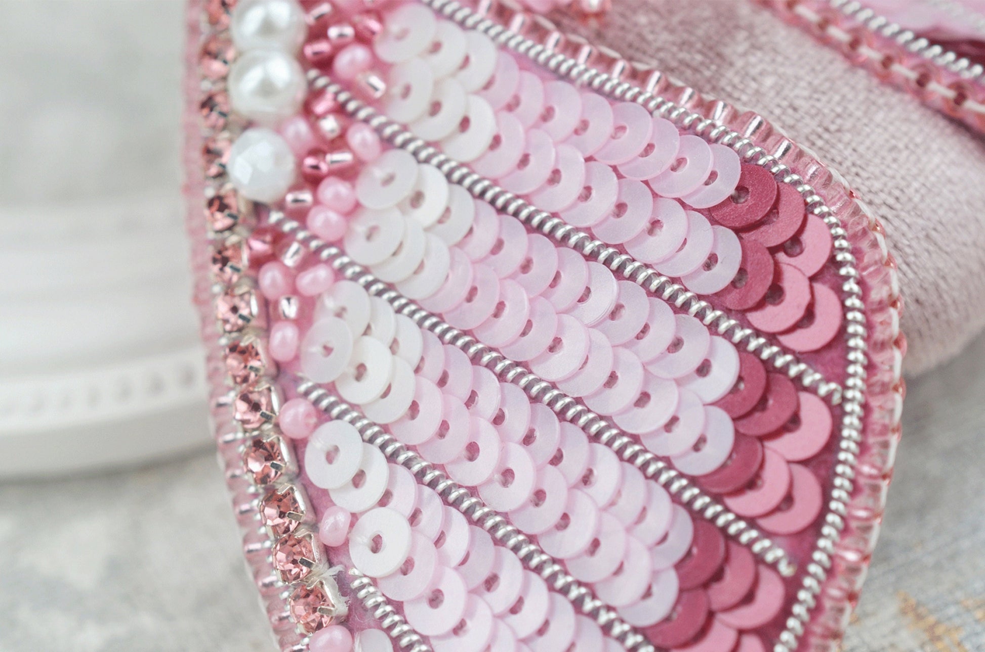 a close up of a pink purse with sequins