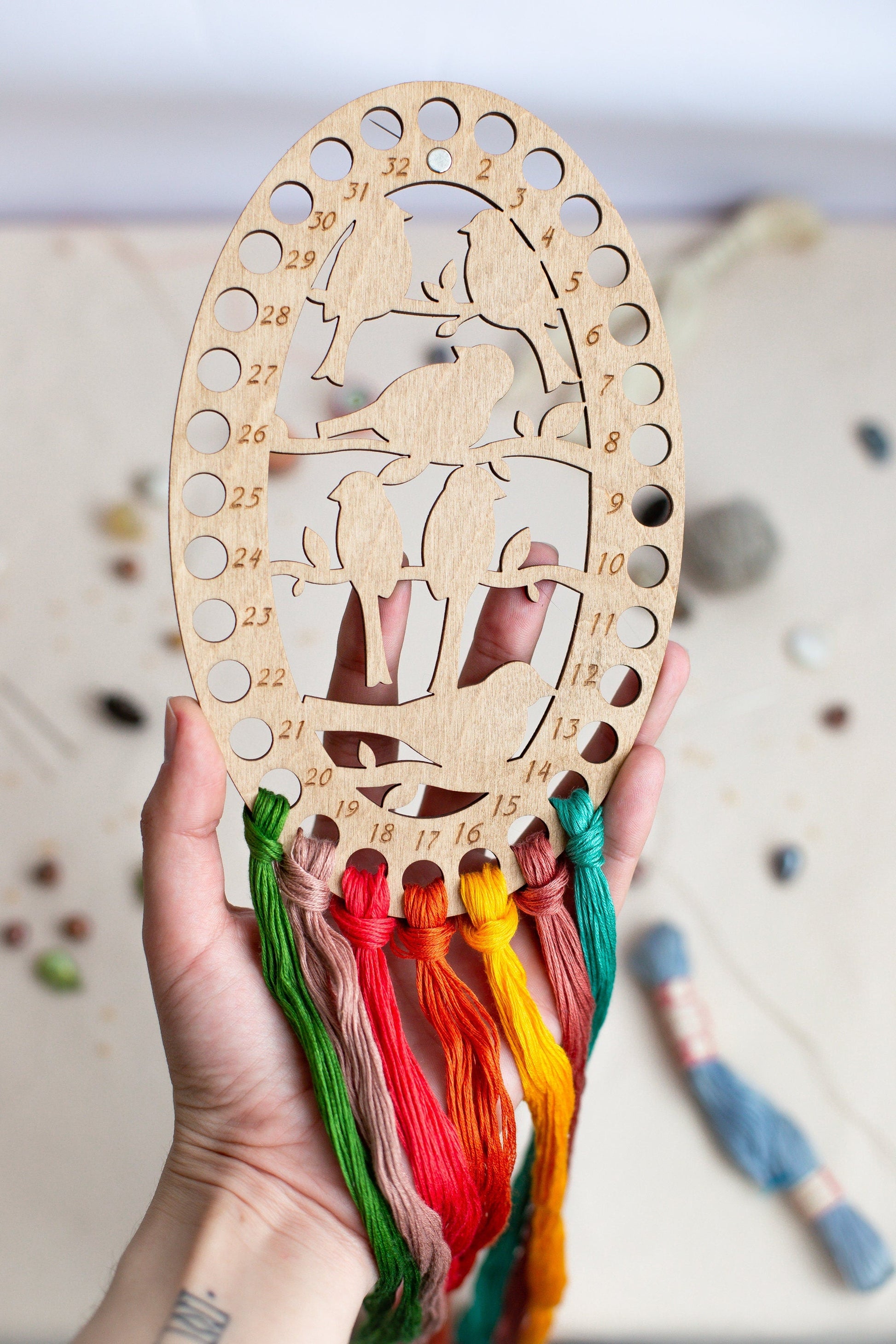 a person holding a wooden cut out of a cow