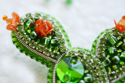 a close up of a mickey mouse brooch