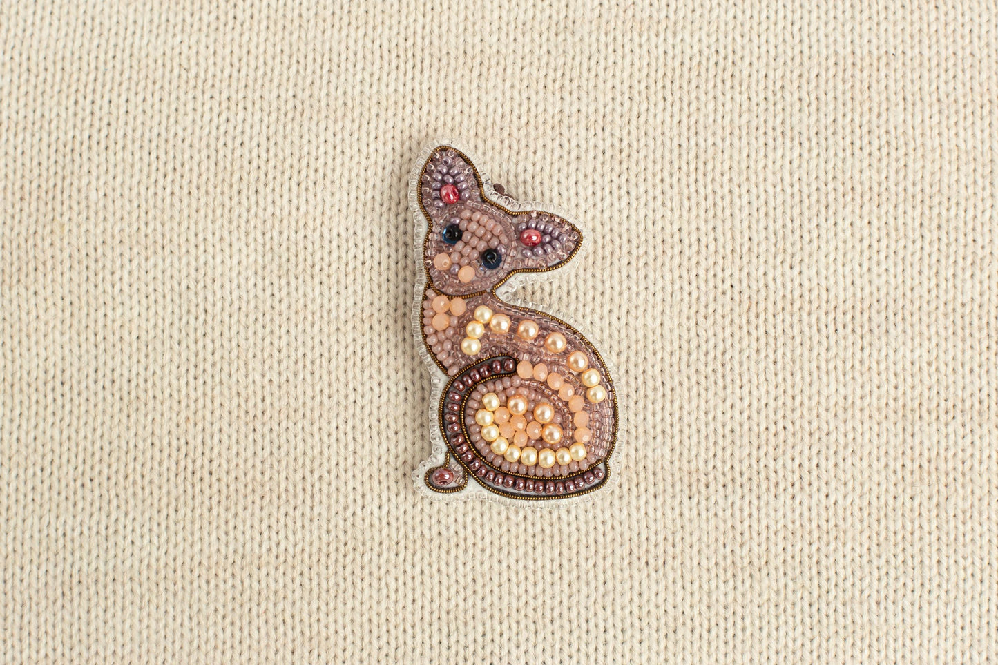 a picture of a small animal made out of beads