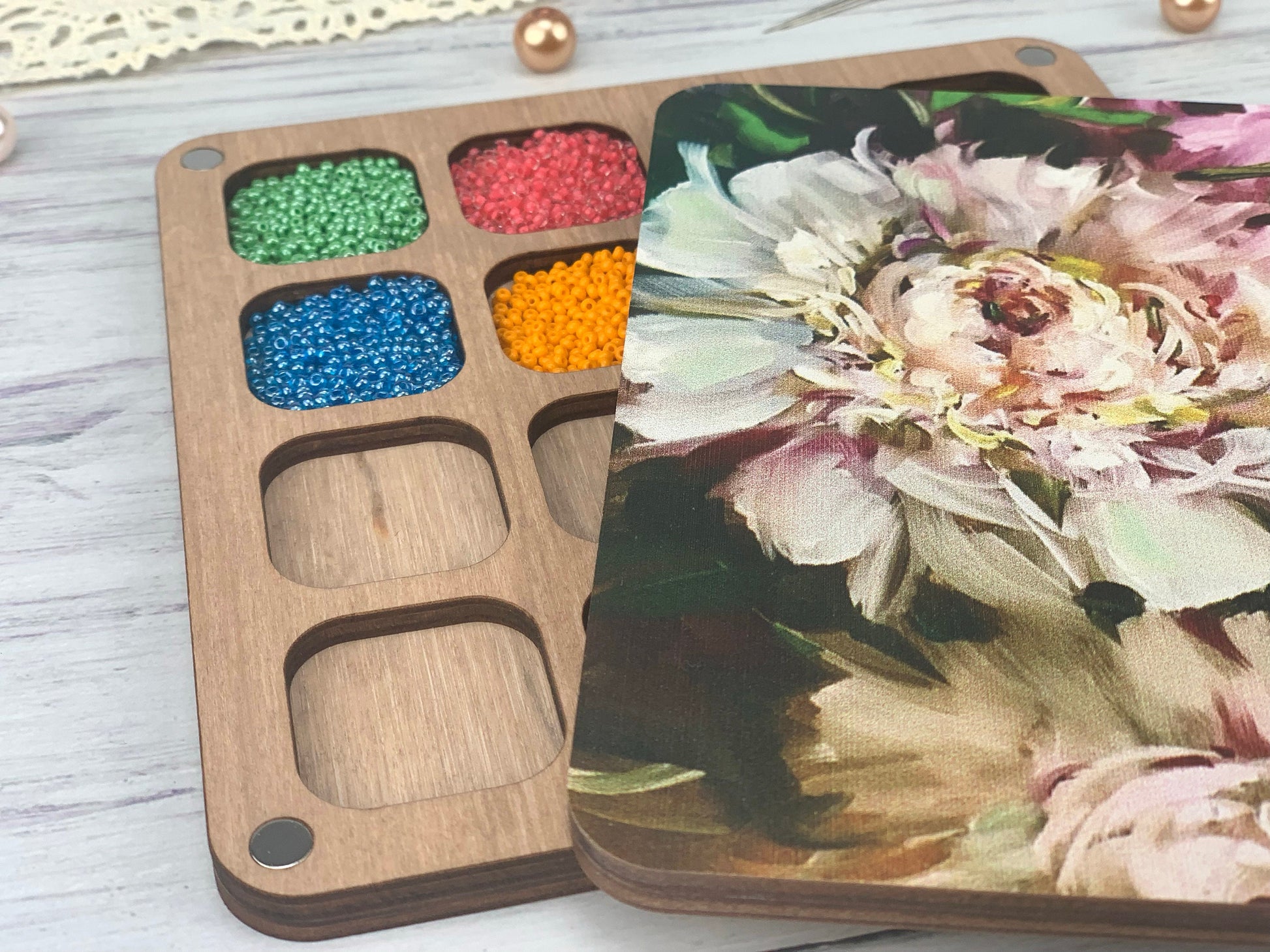 a wooden tray with a flower painting on it