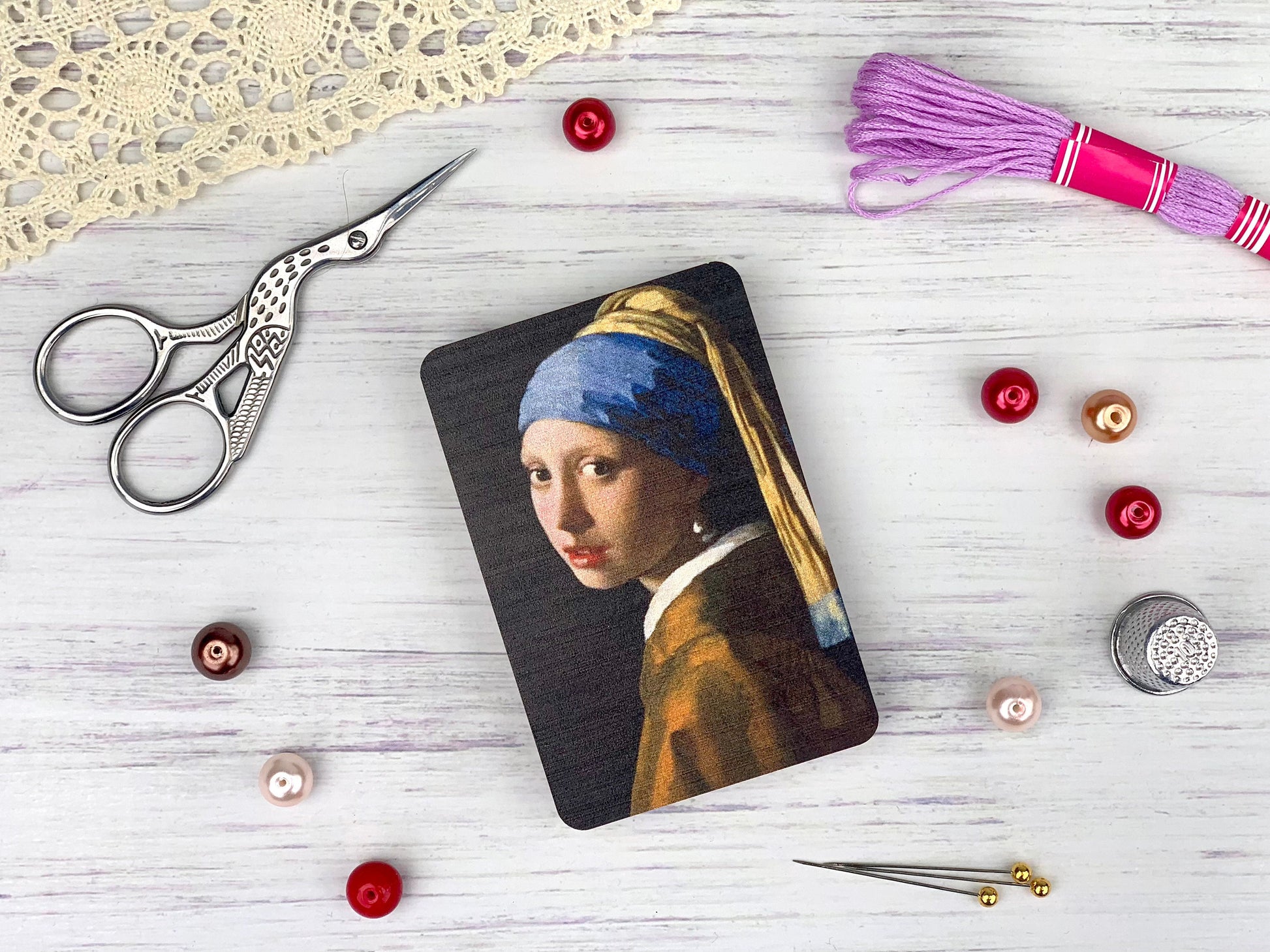 a picture of a girl with a pearl ear