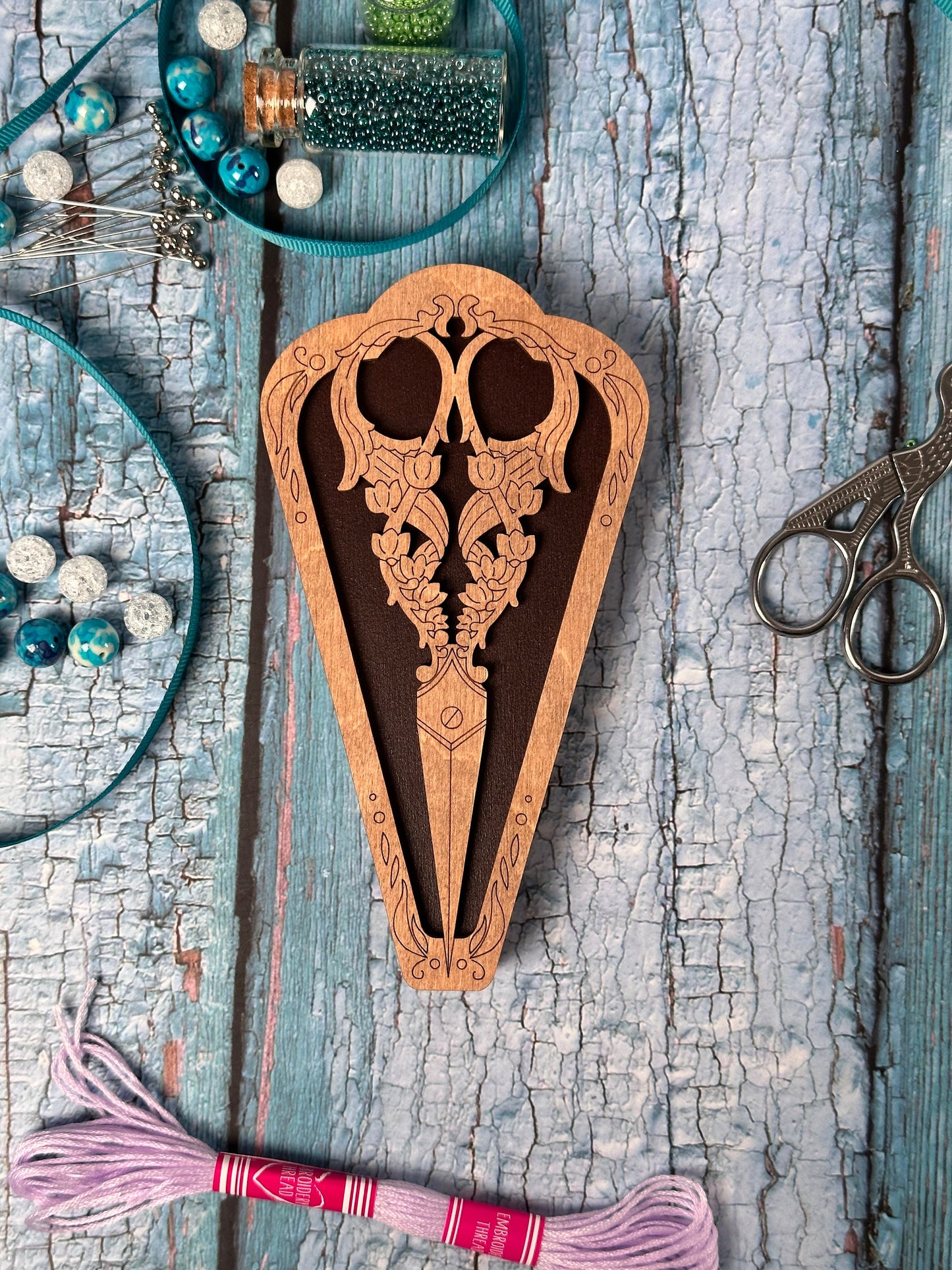a wooden cutting board with a design on it