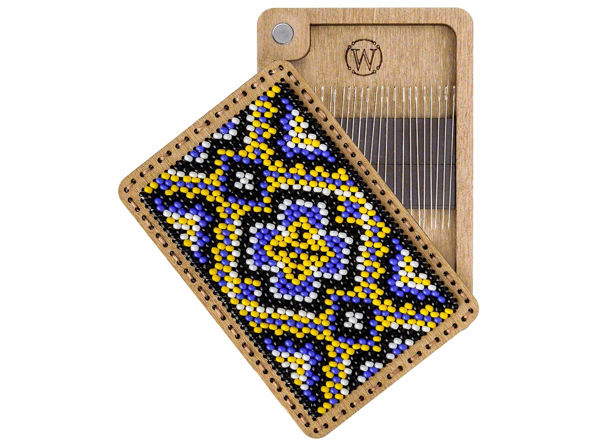 a wooden comb with a beaded design on it