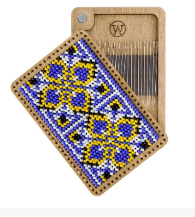 a wooden comb with a blue and yellow design on it
