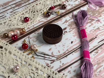 a piece of lace next to a pair of scissors