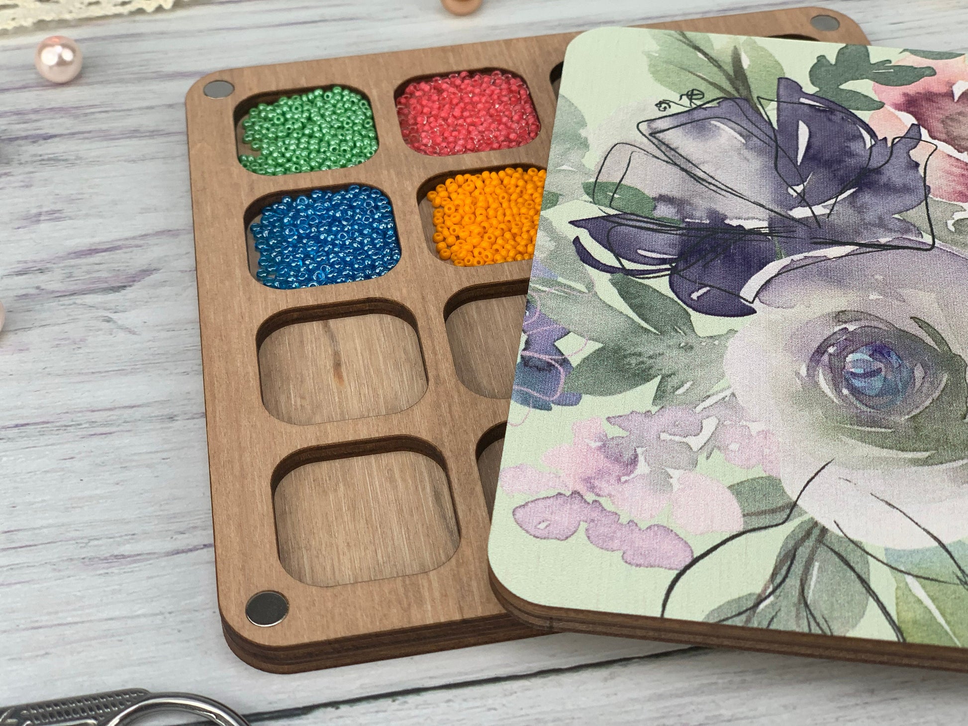 a box of beads next to a box of beads