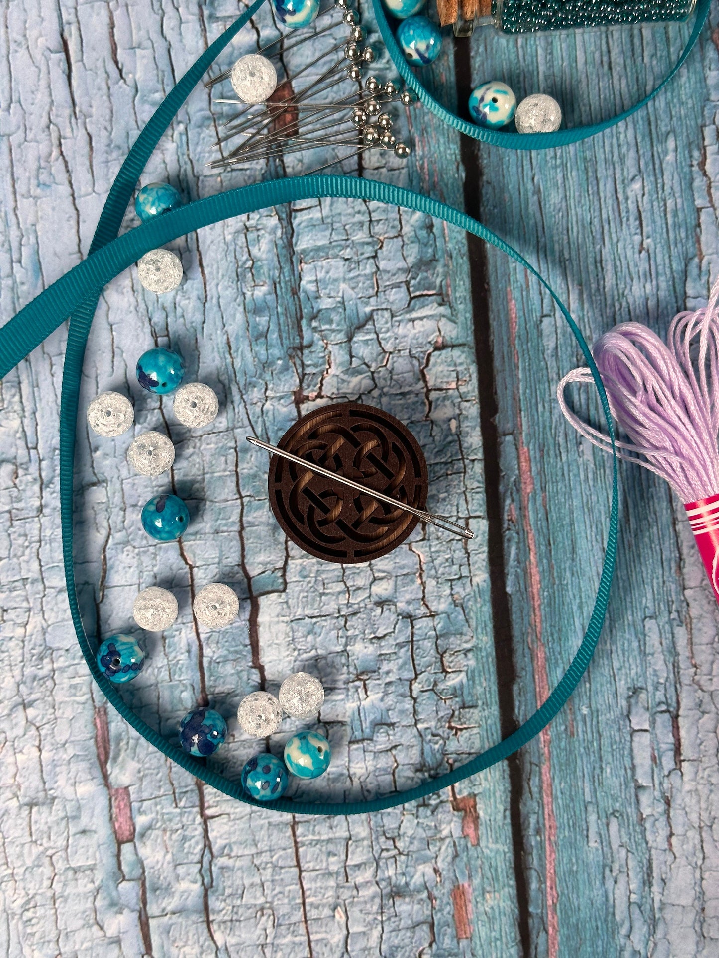 a piece of wood that has some beads on it