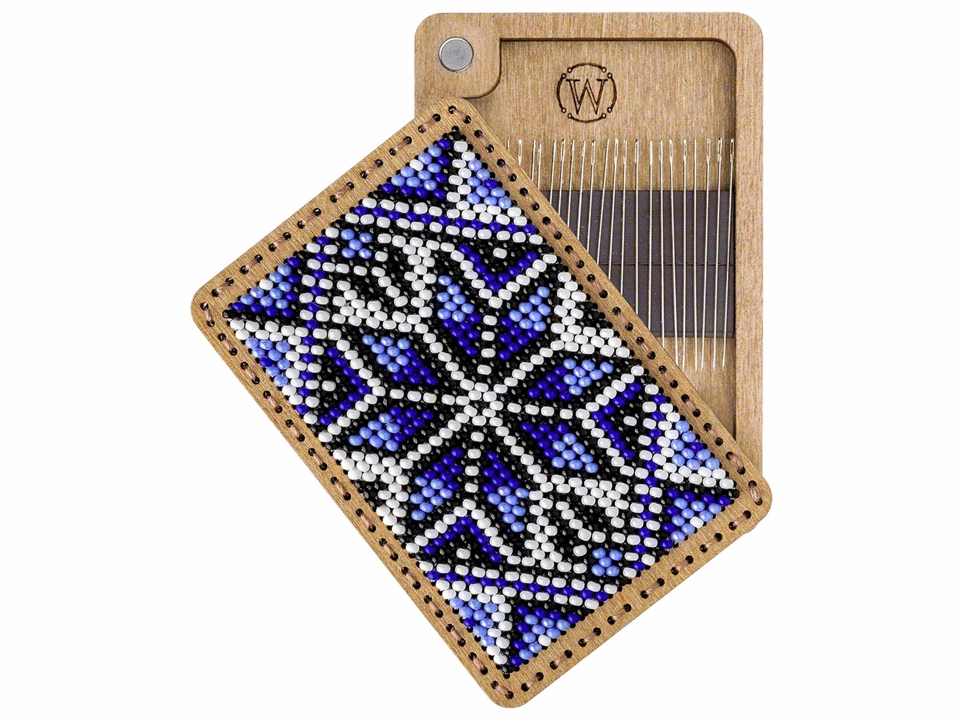 a wooden comb with a beaded design on it