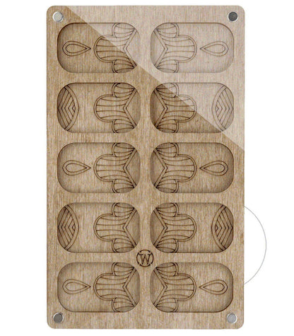 a wooden stamp with an image of a fish