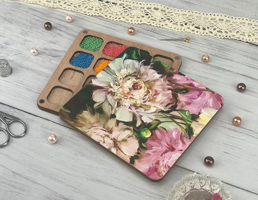 a table topped with crafting supplies and flowers