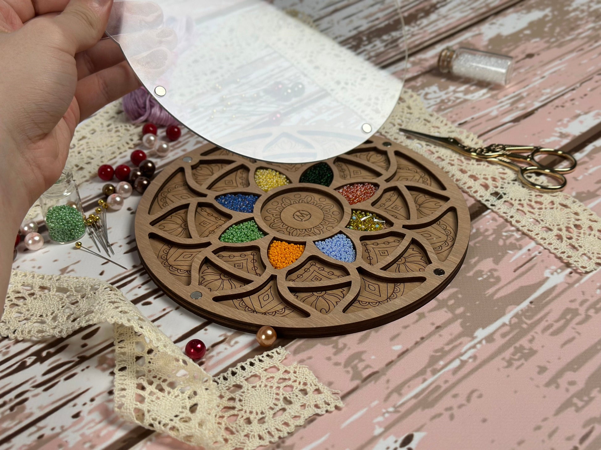 a person cutting a piece of wood with scissors